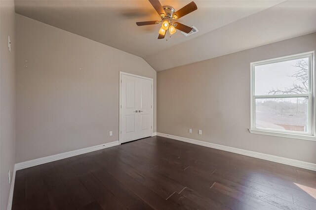 4307 Hershe St, Houston, TX 77020 - empty room featuring dark wood-type flooring, baseboards, vaulted ceiling, and ceiling fan