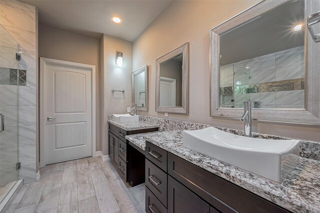 4307 Hershe St, Houston, TX 77020 - full bath with a stall shower, vanity, wood finished floors, recessed lighting, and baseboards