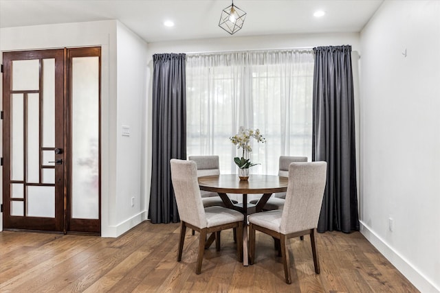 1702 De Milo Dr, Houston, TX 77018 - dining room with wood finished floors, baseboards, and recessed lighting