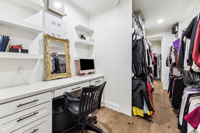 1702 De Milo Dr, Houston, TX 77018 - office space featuring ornamental molding, built in study area, light wood-type flooring, and baseboards