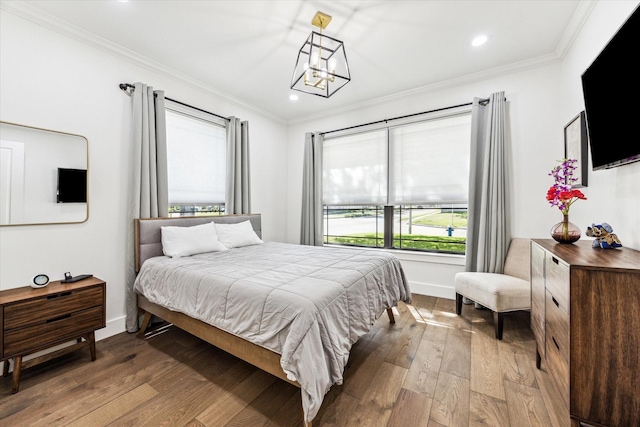 1702 De Milo Dr, Houston, TX 77018 - bedroom with ornamental molding, hardwood / wood-style flooring, a chandelier, recessed lighting, and baseboards