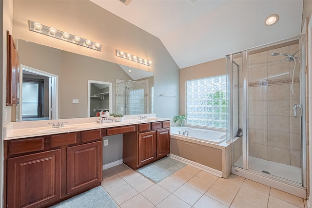 2500 Amy Lee Dr, Conroe, TX 77304 - full bathroom featuring a stall shower, lofted ceiling, double vanity, tile patterned floors, and a bath