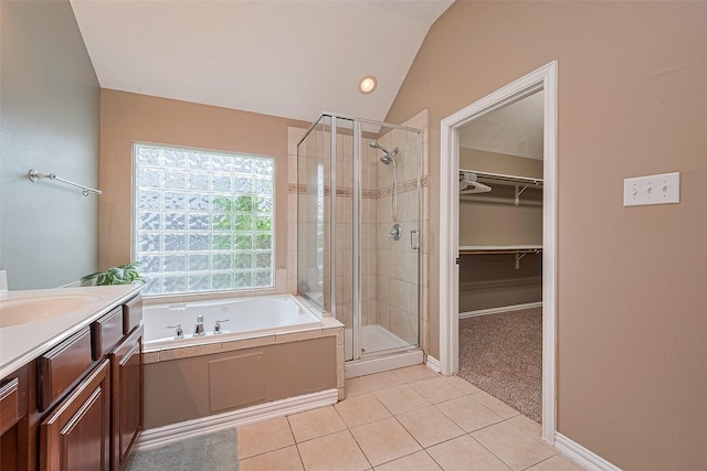 2500 Amy Lee Dr, Conroe, TX 77304 - full bathroom featuring a shower stall, a garden tub, tile patterned flooring, vanity, and a spacious closet