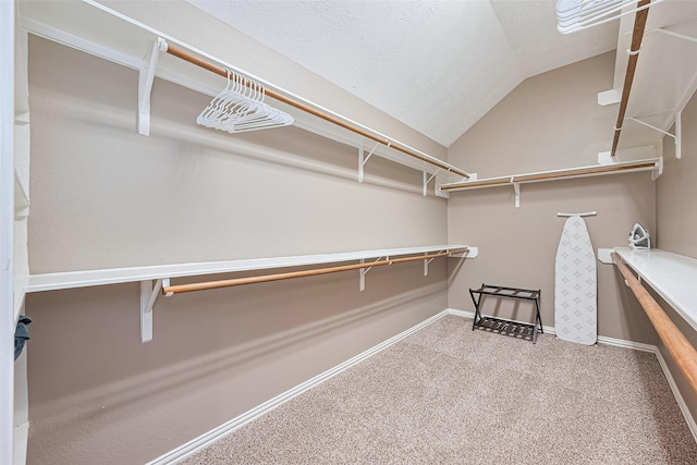 2500 Amy Lee Dr, Conroe, TX 77304 - walk in closet featuring carpet flooring and lofted ceiling
