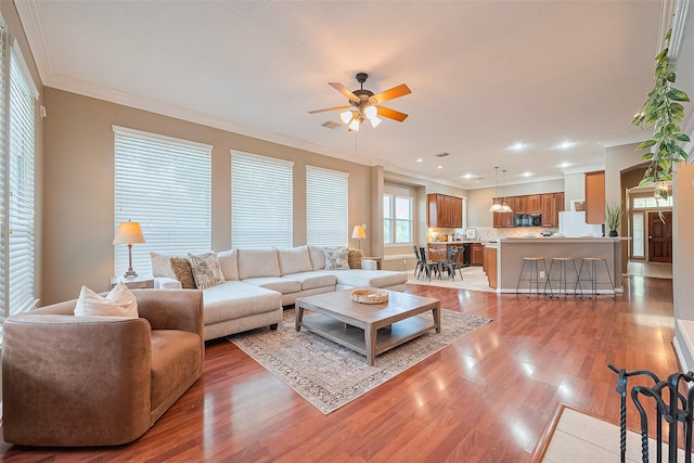2500 Amy Lee Dr, Conroe, TX 77304 - living room with ceiling fan, crown molding, light wood-type flooring, and recessed lighting