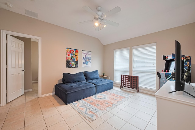 2500 Amy Lee Dr, Conroe, TX 77304 - living area featuring light tile patterned floors, a ceiling fan, and lofted ceiling