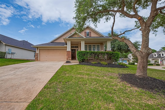 2500 Amy Lee Dr, Conroe, TX 77304 - craftsman-style house with a garage, concrete driveway, a front lawn, brick siding, and covered porch