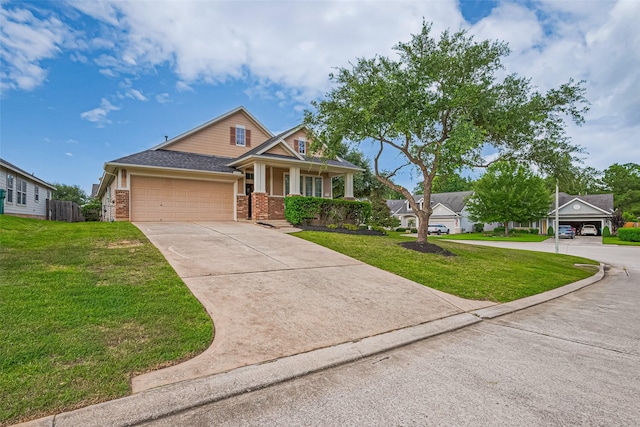 2500 Amy Lee Dr, Conroe, TX 77304 - view of front of house with driveway, covered porch, a garage, and brick siding