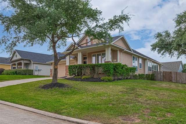 2500 Amy Lee Dr, Conroe, TX 77304 - view of front facade featuring concrete driveway and covered porch