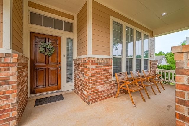 2500 Amy Lee Dr, Conroe, TX 77304 - view of exterior entry featuring covered porch and brick siding