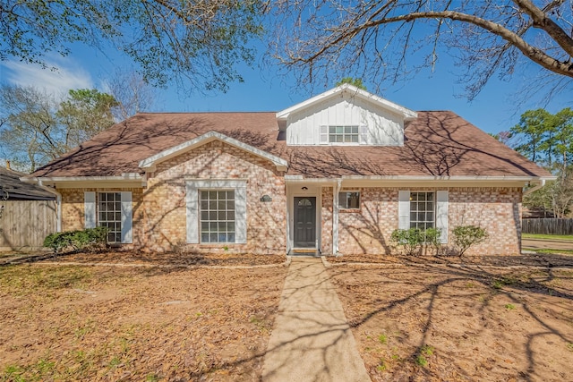 9602 John Bank Dr, Spring, TX 77379 - view of front of house featuring brick siding and fence