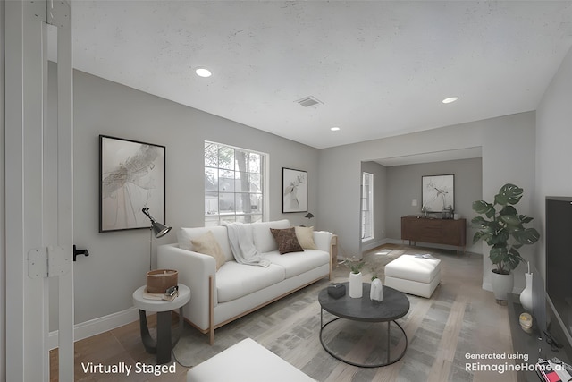 9602 John Bank Dr, Spring, TX 77379 - living area featuring baseboards, wood finished floors, and recessed lighting