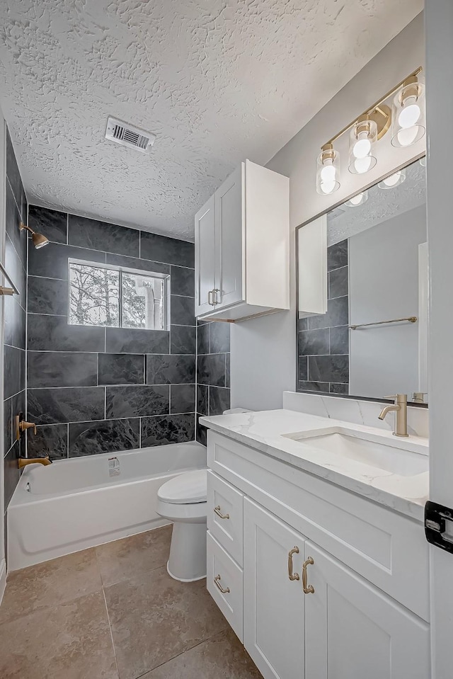 9602 John Bank Dr, Spring, TX 77379 - bathroom featuring toilet, bathtub / shower combination, vanity, and a textured ceiling
