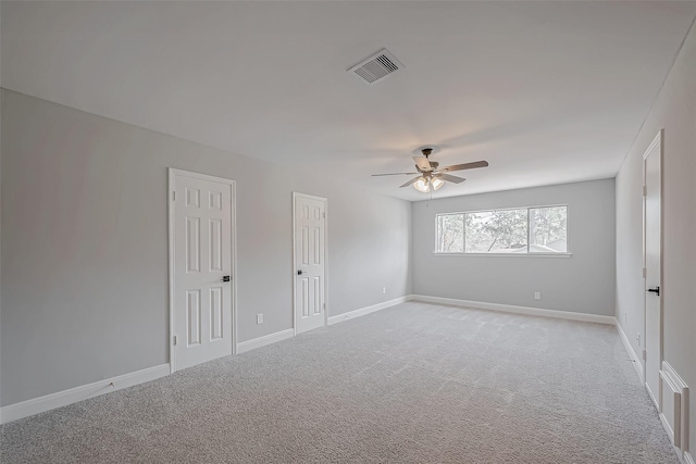 9602 John Bank Dr, Spring, TX 77379 - unfurnished room featuring light colored carpet, a ceiling fan, and baseboards