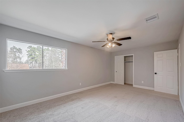 9602 John Bank Dr, Spring, TX 77379 - unfurnished bedroom featuring baseboards, light carpet, a closet, and a ceiling fan