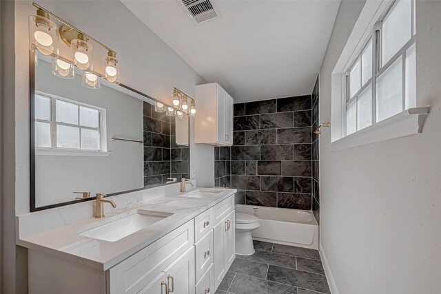 9602 John Bank Dr, Spring, TX 77379 - bathroom with double vanity, baseboards, toilet, and shower / bath combination
