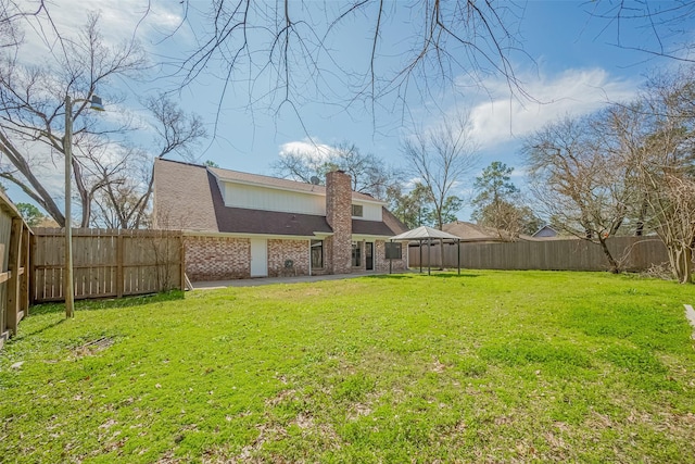 9602 John Bank Dr, Spring, TX 77379 - rear view of property featuring brick siding, a chimney, and a shingled roof