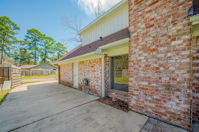 9602 John Bank Dr, Spring, TX 77379 - view of patio / terrace featuring fence and driveway