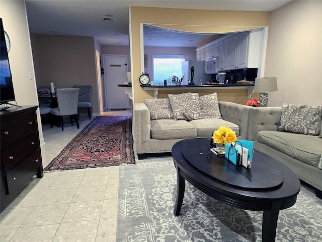 2503 Mccue Rd Unit 13, Houston, TX 77056 - living room with light tile patterned floors