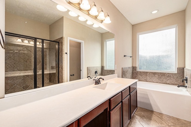 30710 Basil Trace Dr, Spring, TX 77386 - bathroom with a stall shower, a bath, tile patterned floors, and vanity
