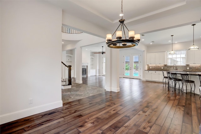 2209 Macarthur St, Houston, TX 77030 - dining room featuring dark wood-style flooring, plenty of natural light, a tray ceiling, a chandelier, and recessed lighting