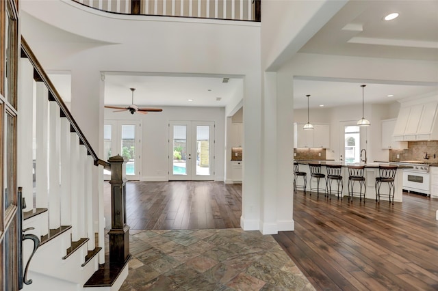 2209 Macarthur St, Houston, TX 77030 - entryway with dark wood-type flooring, ceiling fan, stairs, french doors, and recessed lighting