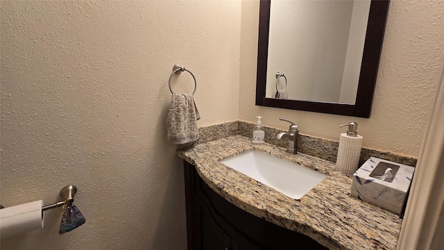 1805 Stoney Brook Dr Unit 103, Houston, TX 77063 - bathroom with vanity and a textured wall