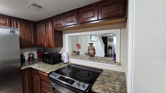 1805 Stoney Brook Dr Unit 103, Houston, TX 77063 - kitchen with appliances with stainless steel finishes