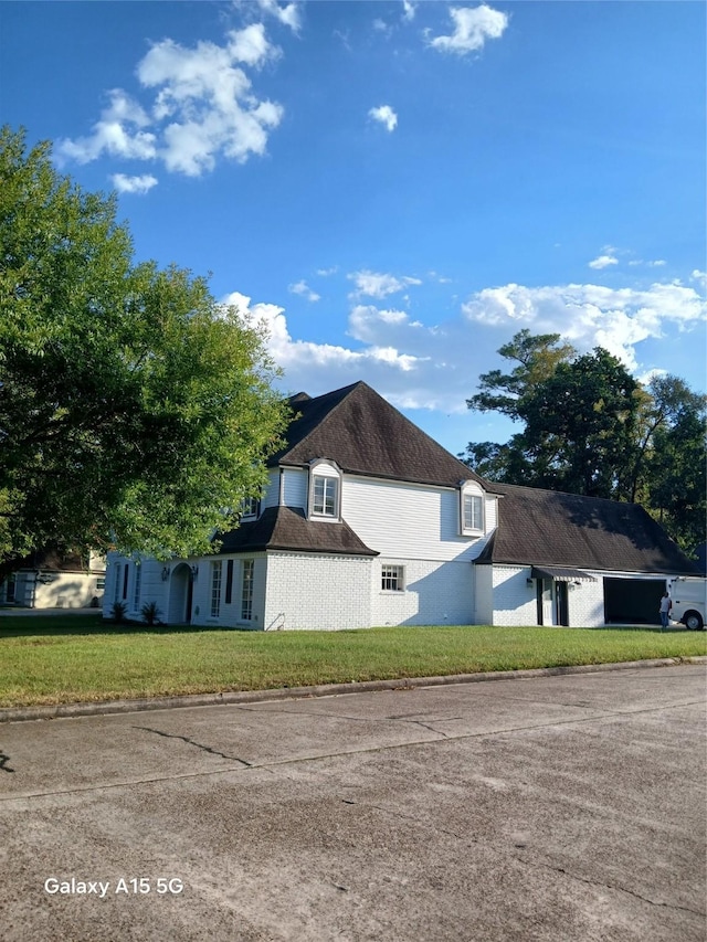 17931 Elk River Cir, Houston, TX 77090 - view of side of home featuring a lawn