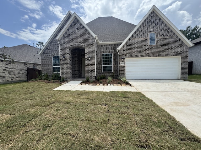 16154 Rustling Woods Rd, Conroe, TX 77302 - view of front of home featuring brick siding, driveway, and a front lawn