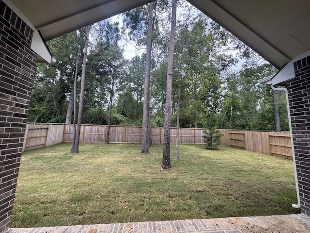 16154 Rustling Woods Rd, Conroe, TX 77302 - fenced backyard featuring view of wooded area
