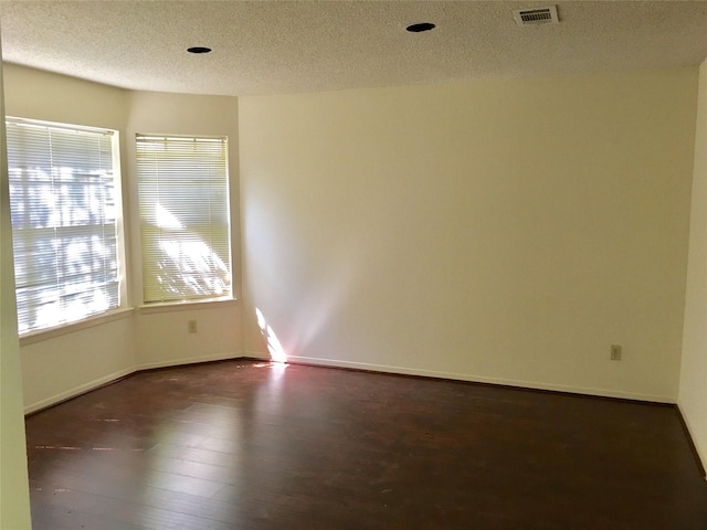 2615 Austins Pl, Sugar Land, TX 77478 - spare room featuring dark wood finished floors, a textured ceiling, and baseboards