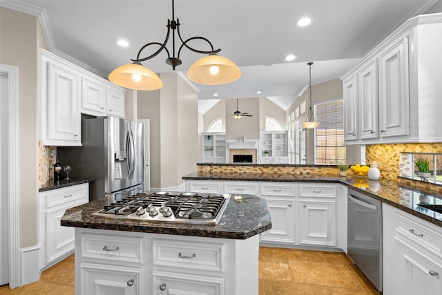 6910 Amber Ct, Houston, TX 77069 - kitchen featuring stainless steel appliances, a ceiling fan, recessed lighting, white cabinetry, and tasteful backsplash