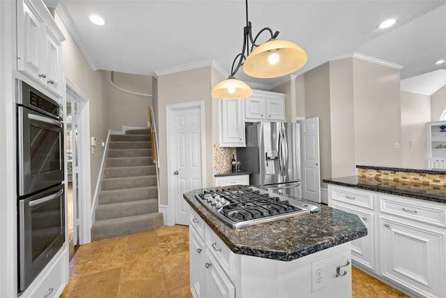 6910 Amber Ct, Houston, TX 77069 - kitchen featuring appliances with stainless steel finishes, ornamental molding, backsplash, white cabinets, and decorative light fixtures