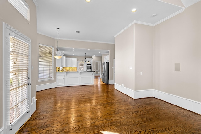 6910 Amber Ct, Houston, TX 77069 - unfurnished living room featuring dark wood-style floors, baseboards, crown molding, and recessed lighting