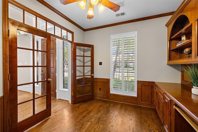 6910 Amber Ct, Houston, TX 77069 - doorway featuring french doors, dark wood-style floors, a ceiling fan, a wainscoted wall, and healthy amount of natural light