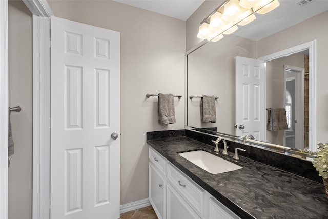 6910 Amber Ct, Houston, TX 77069 - bathroom with vanity, baseboards, and tile patterned flooring