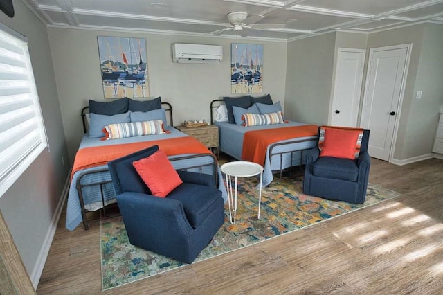 450 County Road 206, Sargent, TX 77414 - bedroom featuring a wall unit AC, wood finished floors, multiple windows, baseboards, and crown molding