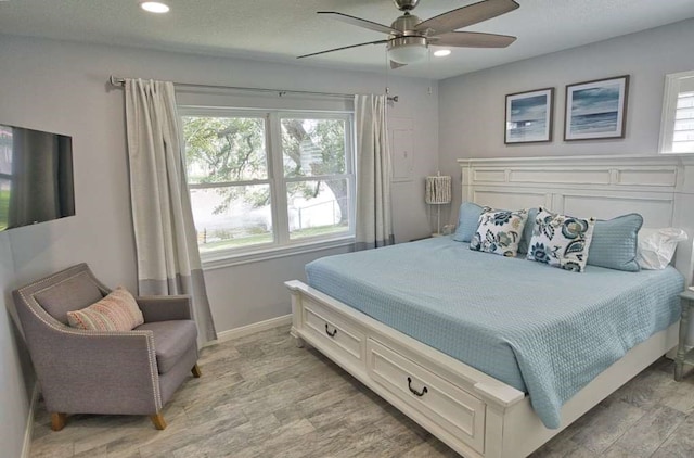 450 County Road 206, Sargent, TX 77414 - bedroom featuring recessed lighting, baseboards, light wood-type flooring, and a ceiling fan