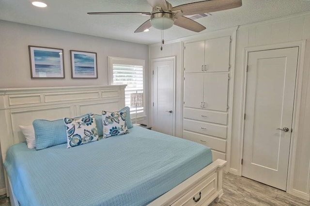 450 County Road 206, Sargent, TX 77414 - bedroom with light wood-style flooring, recessed lighting, and a ceiling fan