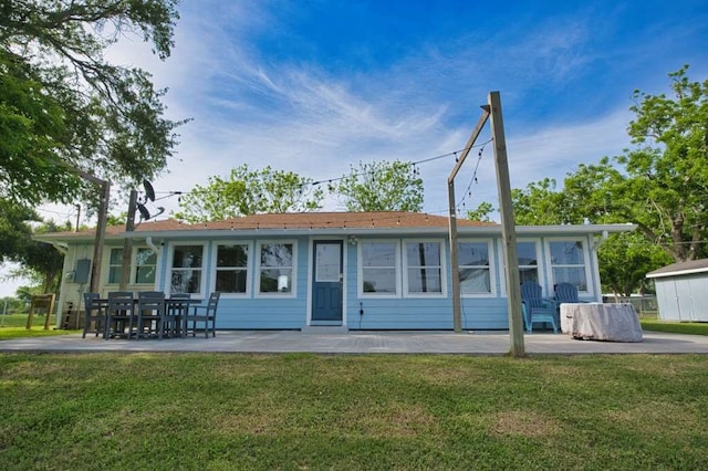 450 County Road 206, Sargent, TX 77414 - rear view of property with a yard and a patio