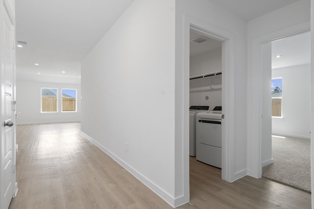 305 Robin St, Angleton, TX 77515 - corridor featuring baseboards, independent washer and dryer, light wood-style floors, plenty of natural light, and recessed lighting