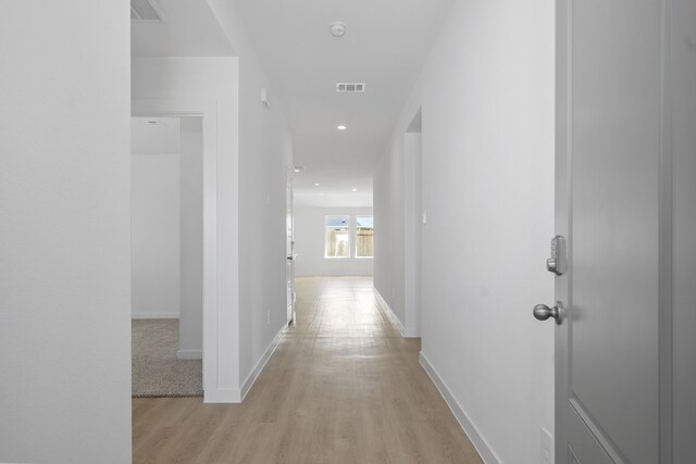 305 Robin St, Angleton, TX 77515 - hallway with light wood-style flooring, baseboards, and recessed lighting