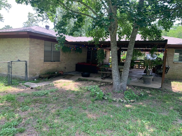 26405 Easy St, Magnolia, TX 77355 - back of property featuring a patio area, brick siding, and fence