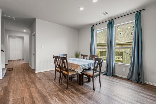 819 Spruce Pine Dr, Conroe, TX 77318 - dining area featuring wood finished floors, baseboards, and recessed lighting