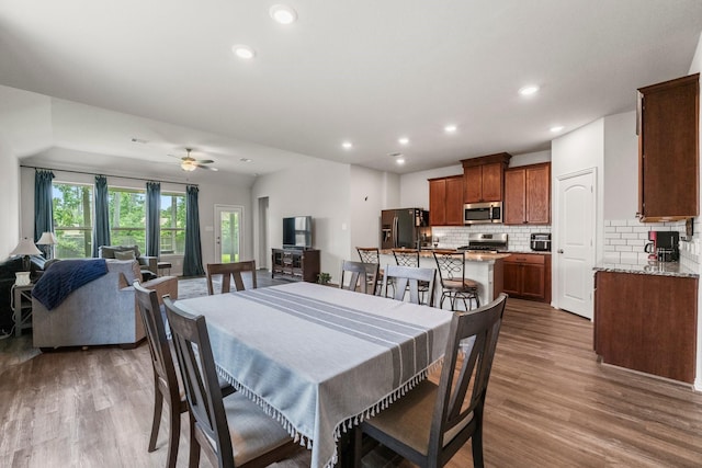 819 Spruce Pine Dr, Conroe, TX 77318 - dining area featuring wood finished floors, recessed lighting, and a ceiling fan