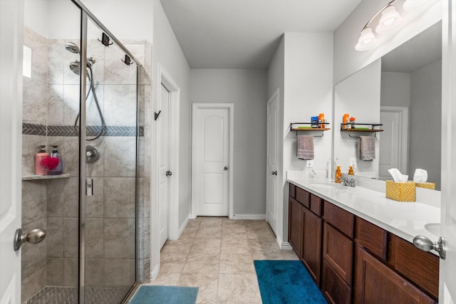 819 Spruce Pine Dr, Conroe, TX 77318 - full bath with a stall shower, double vanity, and baseboards