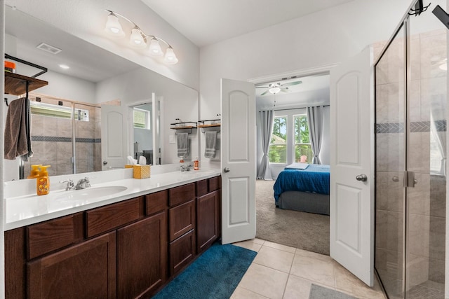 819 Spruce Pine Dr, Conroe, TX 77318 - full bath featuring double vanity, tile patterned floors, a shower stall, ensuite bath, and ceiling fan
