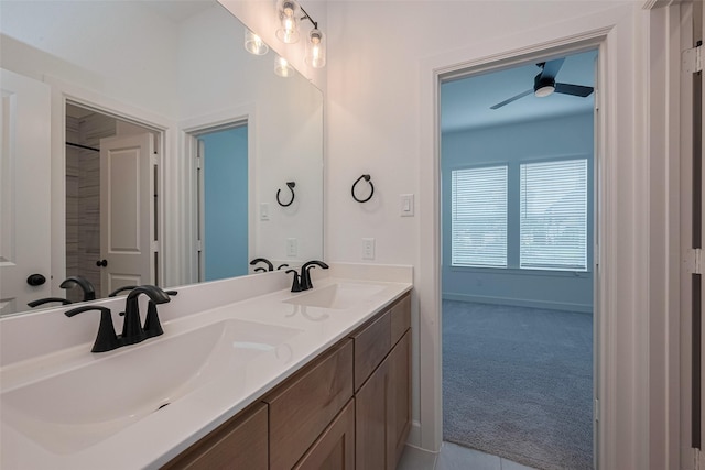 2610 Texas Orange Trl, Richmond, TX 77406 - full bathroom featuring a ceiling fan, double vanity, baseboards, and tile patterned floors