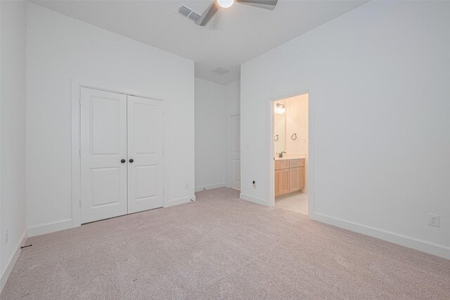 2610 Texas Orange Trl, Richmond, TX 77406 - unfurnished bedroom featuring light carpet, a closet, and baseboards